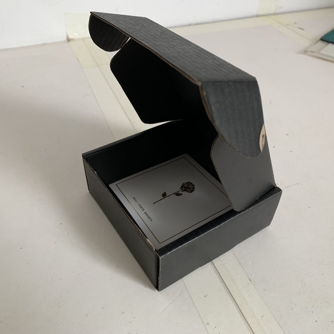 Kraft corrugated shipping boxes, one open showing the flute structure
